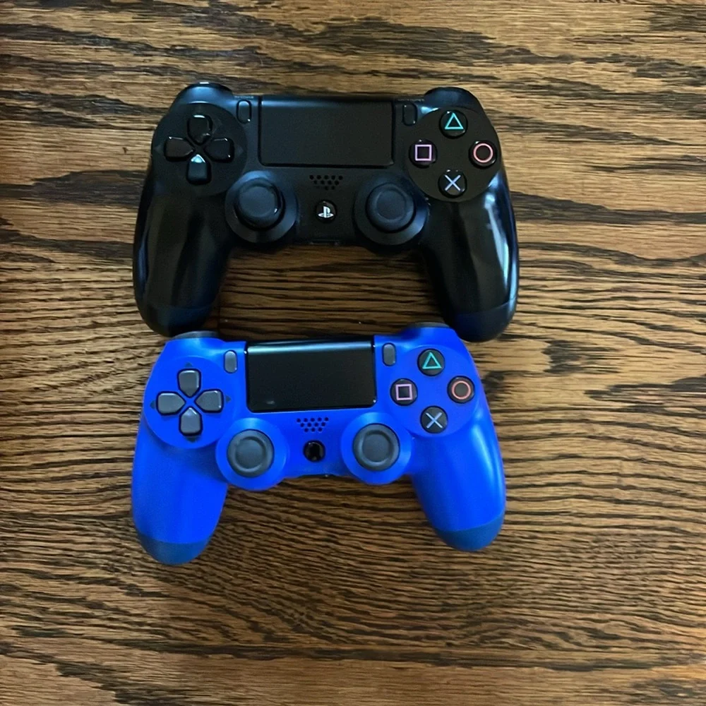 PS4 Console with dual controllers, controller charging station with 16 PS4 games